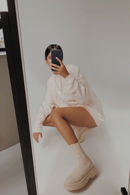 a neutral mini hoodie dress paired with nude Chelsea boots for a super stylish and sexy sporty fall look