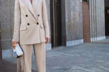 a pearl grey pantsuit, apple green shoes, a small and catchy tow-tone box bag for a chic fall work look