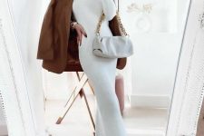 a white midi turtleneck dress, a rust-colored leather jacket, nude Chelsea boots and a white bag on chain