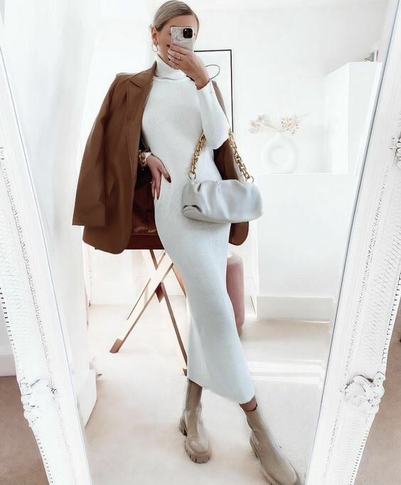 a white midi turtleneck dress, a rust-colored leather jacket, nude Chelsea boots and a white bag on chain