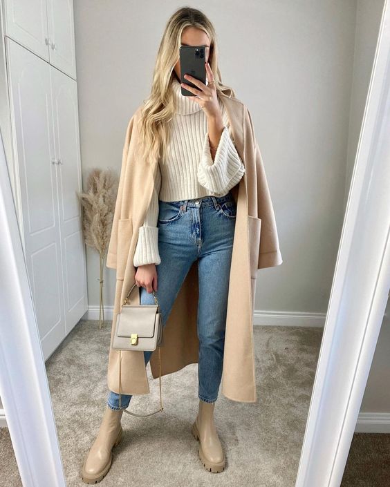 a white ribbed sweater, blue jeans, a tan trench, nude Chelsea boots and a grey mini bag for the fall