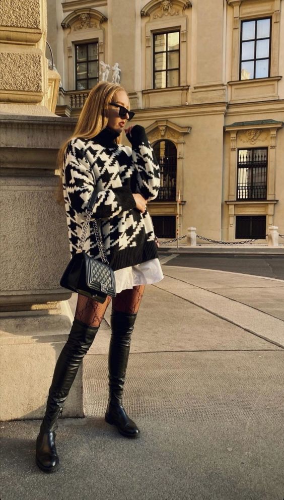 a white shirtdress, a printed black and white sweater, black over the knee boots, a black bag for the fall