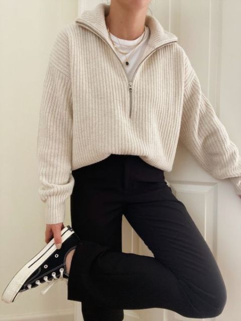 a white t-shirt, a neutral zip sweater, black pants, black sneakers to compose a comfy look