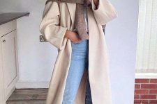 a white t-shirt, blue cropped jeans, a creamy coat, a taupe sweater over the shoulders, nude Chelsea boots