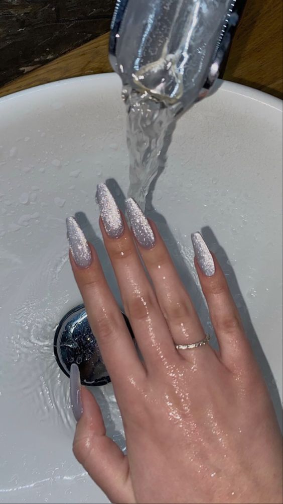 beautiful super long silver velvet nails of a coffin shape are gorgeous for a trendy, chic and feminine look