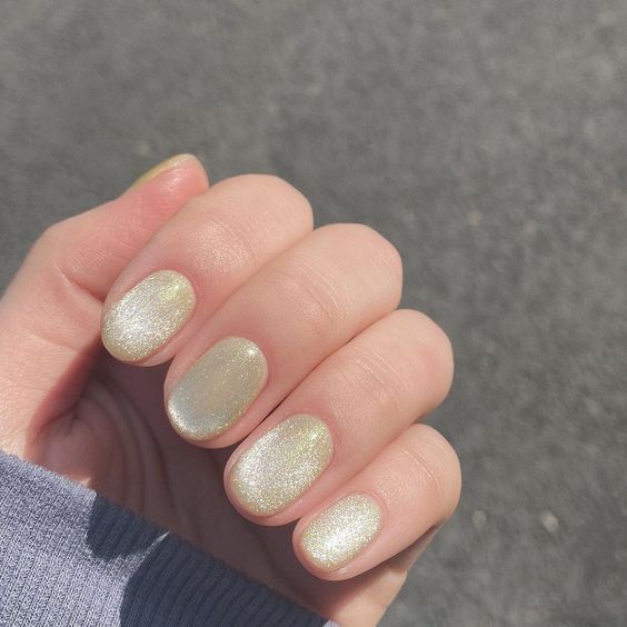 pastel yellow velvet nails are a soft and warm touch of color to your look on a cold day - they are lovely and bright