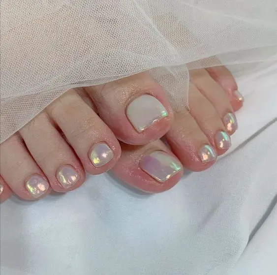 holographic toe nails are a fresh take on neutrals that will add a touch of shine and just a bit of color to your look