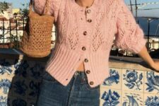 11 a beautiful vintage-inspired outfit with a blush vintage crochet cardigan as a top, navy jeans and a woven bag