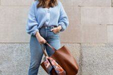 12 a blue chunky knit cardigan, blue cropped jeans, white trainers, a brown tote for a simple and cool fall work look
