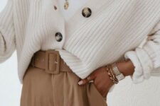 16 a beautiful neutral outfit with a white top, a creamy chunky cardigan, layered necklaces and beige high waisted pants