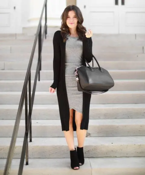 With black leather tote bag and black suede cutout heeled ankle boots