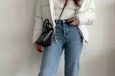 With blue cuffed jeans, black leather crossbody bag and black boots