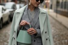 With gray t-shirt, mint green leather basket bag, oversized sunglasses and earrings
