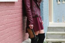 With leopard printed clutch and black suede over the knee boots