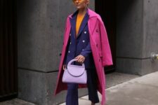 With orange shirt, sunglasses, lilac leather bag and pink suede pumps
