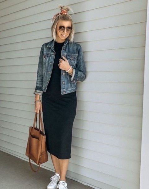 With oversized sunglasses, brown leather tote bag and white and black lace up flat shoes