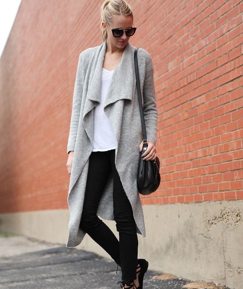 With sunglasses, white loose t-shirt, black skinny pants, black leather bag and black lace up flat shoes