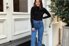 a black turtleneck, blue mom jeans and snakeskin print boots are a great look for the fall