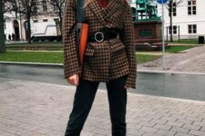 a burgundy turtleneck, black jeans, hot red booties, a plaid blazer with a black belt and a black and orange tote