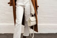 a chic fall outfit with a white jumper, white mom jeans, rust-colored boots, a brown trench and a white bag