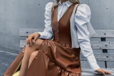 a feminine outfit with a white blouse and puff sleeves, a brown midi pinafore dress, white sock boots for a girlish person