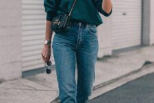 a green sweatshirt, blue mom jeans, nude heeled sandals and a black mini bag are great for the fall
