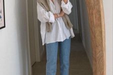 a white oversized shirt, blue cropped jeans,a  tan sweater over the shoulders and black chunky loafers to rock in the fall