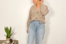 blue mom jeans, a greige cardigan tucked in as a shirt and white mules for a comfy fall look
