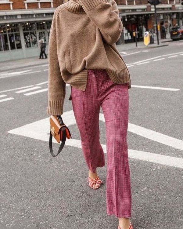 a beige sweater, pink plaid trousers, red polka dot bow shoes and an orange bag are great for Thanksgiving
