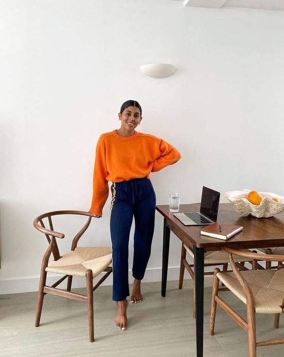 a bright fall outfit with an orange jumper, bold blue pants - add shoes and go