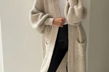 26 a simple and cozy Thanksgiving outfit with a white top, black leggings, a creamy midi cardigan, grey slippers and a necklace