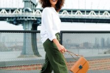 28 a white shirt, green oversized wideleg pants, yellow shoes and a camel bag for an outfit in fall colors