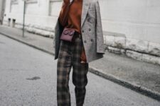 30 a brown top, black plaid trousers, brown boots, a grey plaid blazer and a plum-colored mini bag