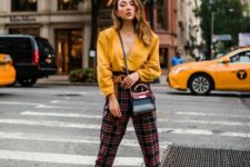 30 a yellow shirt, plaid pants, metallic gold booties and a two tone mini bag for a bold and sexy look