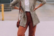 35 a white t-shirt, a grey oversized plaid blazer, rust-colored trousers, matching loafers and a bag