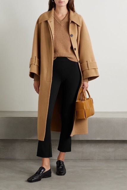 With beige midi coat, brown leather bag and black leather flat shoes
