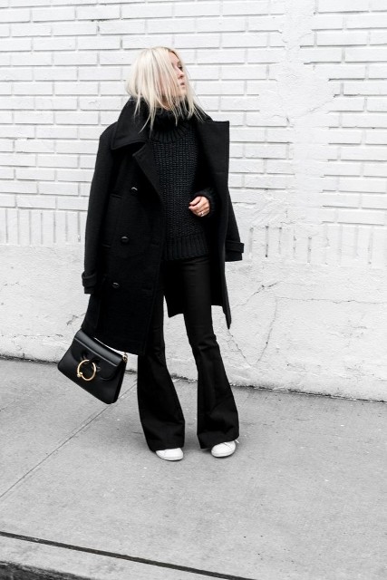 With black coat, white flat shoes and black leather bag