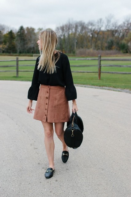 With black leather tote bag and black leather flat shoes