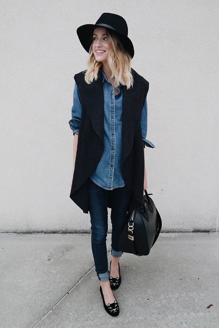 With black wide brim hat, blue cuffed skinny jeans, black leather bag and black printed flat shoes
