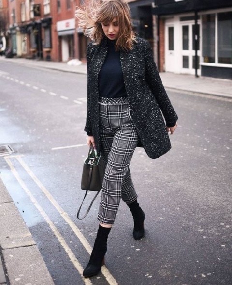 With gray tweed collarless coat, black suede mid calf boots and black leather bag
