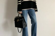 With loose flare jeans, brown suede heeled shoes and black leather bag
