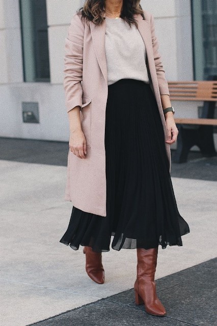 With pale pink midi coat and brown leather high boots