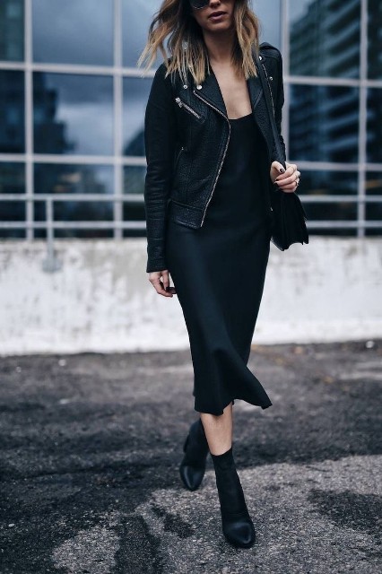 With sunglasses, black leather bag and black leather mid calf heeled boots