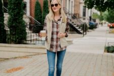 With sunglasses, blue skinny jeans and brown leather low heeled ankle boots