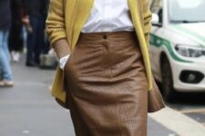 With sunglasses, mustard yellow long cardigan and emerald green leather shoes