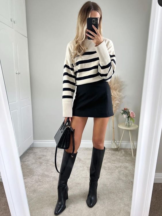a Breton stripe sweater, a black mini skirt, black knee boots and a black bag are a perfect combo for the fall