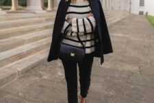 a Breton stripe sweater, black jeans, a black blazer, two tone shoes and a black bag for work