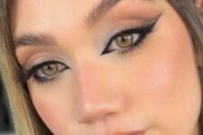 a bold foxy siren eye makeup with a shiny lip, a touch of blush and eyeshadow is a lovely idea
