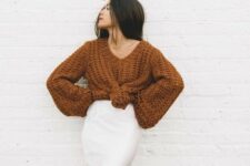 a chic Thanksgiving look with a rust-colored chunky sweater, a white midi skirt is amazing