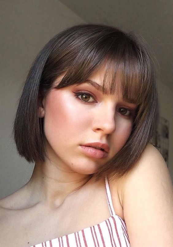 a classy shower brunette bob with curtain and classic bangs is a veyr cute and very girlish idea